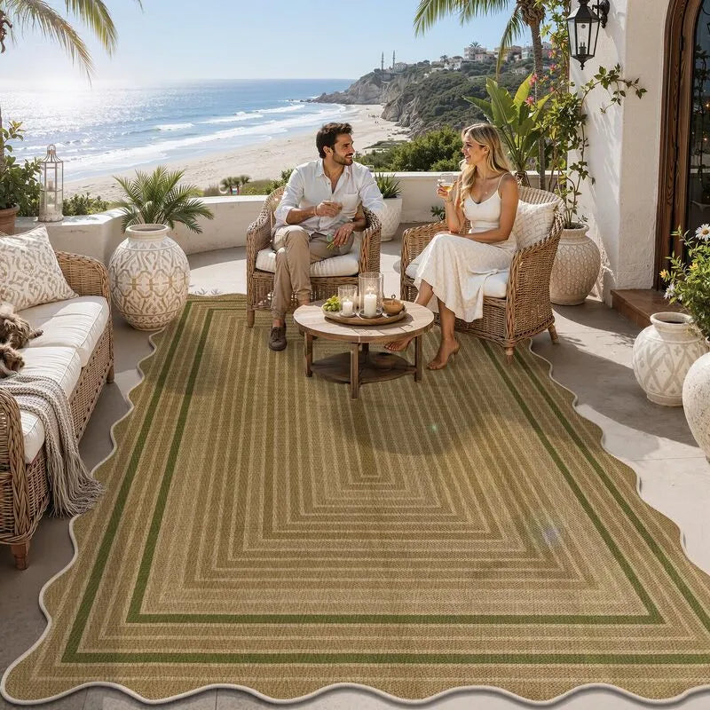 Green 5x8 indoor outdoor area rug with geometric border on California coastal patio, heberug. Model AR009685.