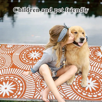 AR001982_orange_5x8_kid_and_pet_friendly_outdoor_rug_plastic_straw_mat_girl_with_dog_heberug