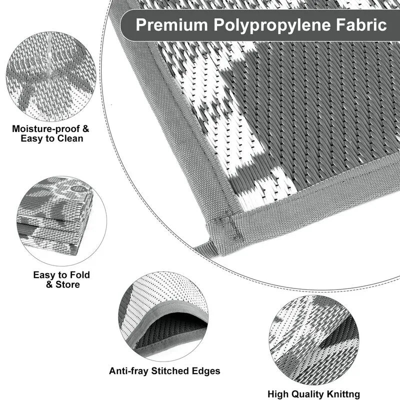 AR002197_grey_8x10_polypropylene_plastic_straw_rug_durable_material_fold_detail_heberug