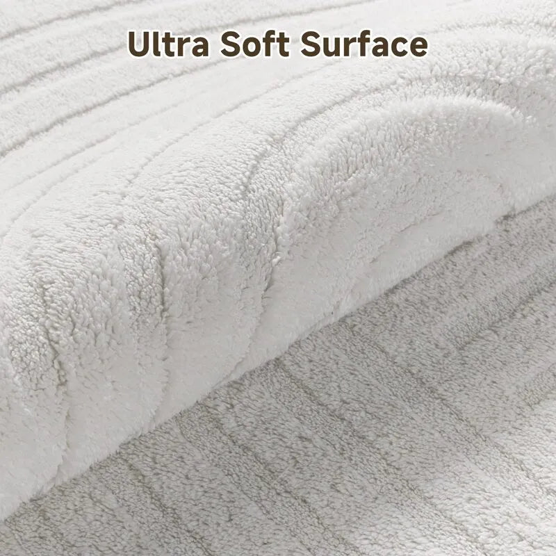 AR009388beigeultrasoftplushsurfacehighlowwavetextured5x7arearugcloseupheberug