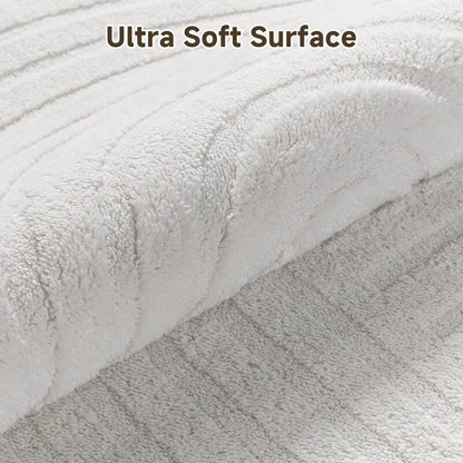 AR009388beigeultrasoftplushsurfacehighlowwavetextured5x7arearugcloseupheberug