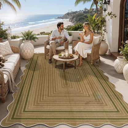 Green 5x8 indoor outdoor area rug with geometric border on California coastal patio, heberug. Model AR009685.